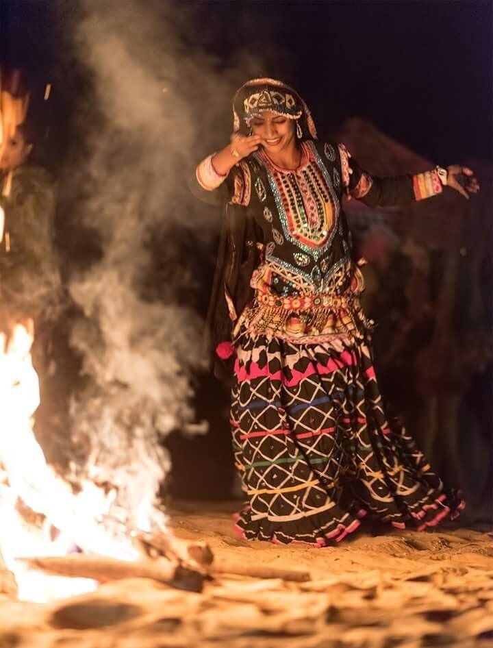 Kalbelia folk dancer by firelight, Rajasthan
